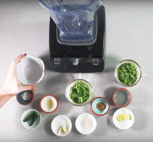 small bowls of mint chutney ingredients in front of a blender