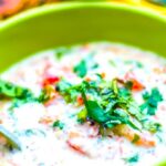 Carrot Cucumber Tomato Raita in a green bowl