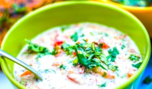 Carrot Cucumber Tomato Raita in a green bowl