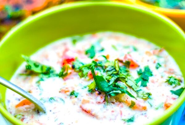 Carrot Cucumber Tomato Raita in a green bowl